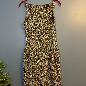 Joppa Floral Smocked back lined dress with pleats at the hips. Very cute.